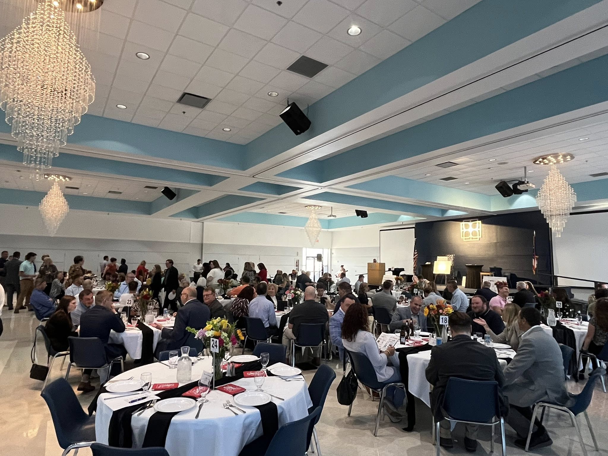 St. Clairsville Chamber Awards Local Businesses and Individuals ceremony in a large ballroom with circular tables.