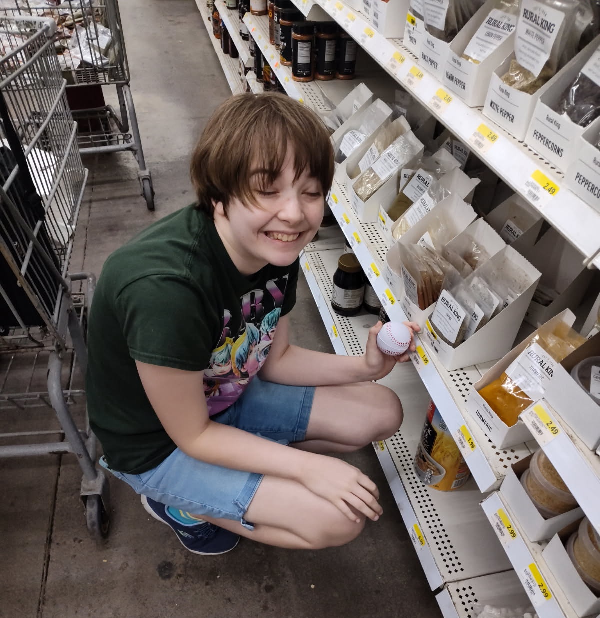 Annabelle crouched down and stocking shelves