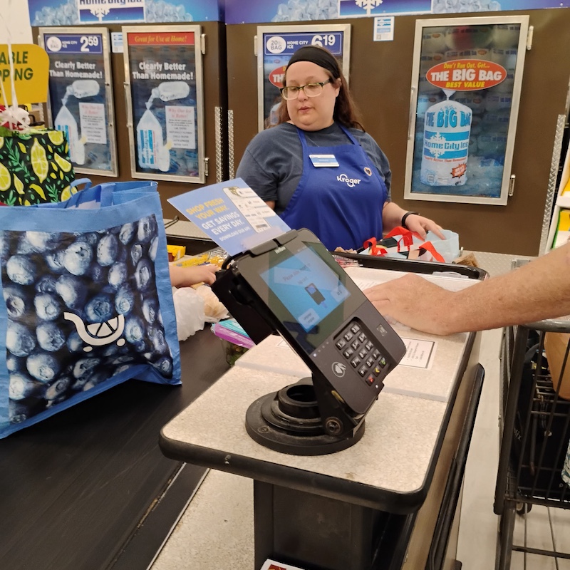 Brittany working as a cashier