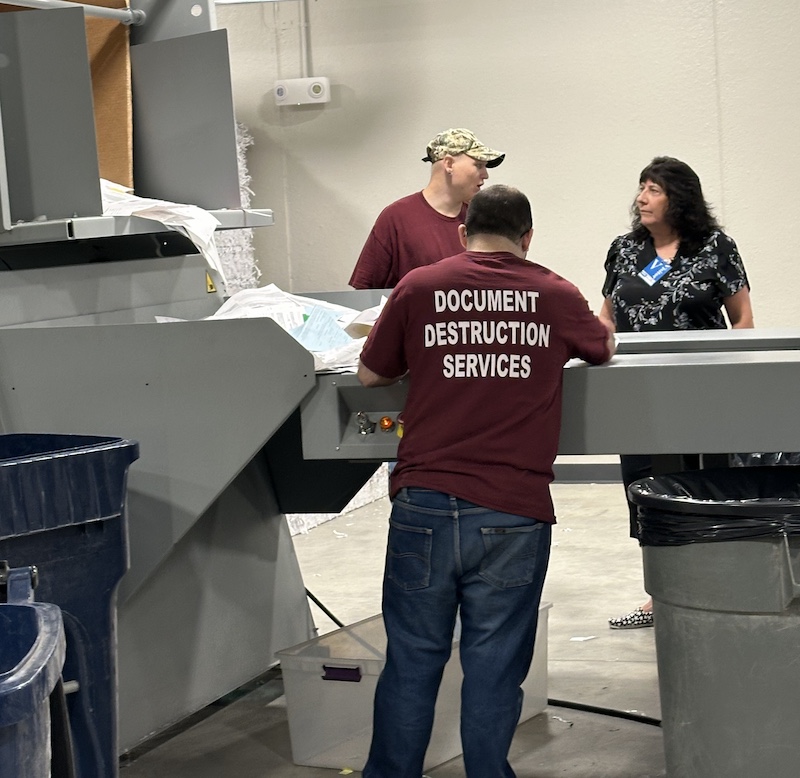 Kim talking to document destruction employee